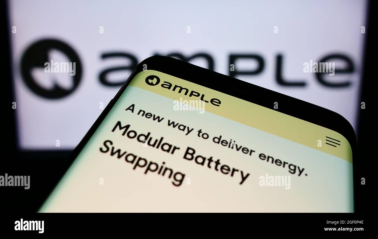 Cellphone with webpage of US electric mobility company Ample Inc. on ...