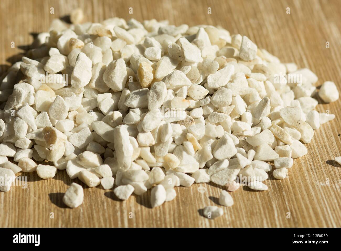 Heap of zeolite stone on wooden background Stock Photo Alamy