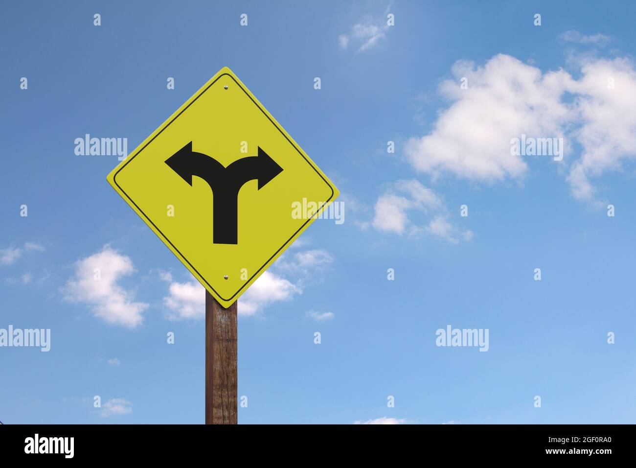 Yellow fork in road sign with copy space. 3d illustration Stock Photo Alamy