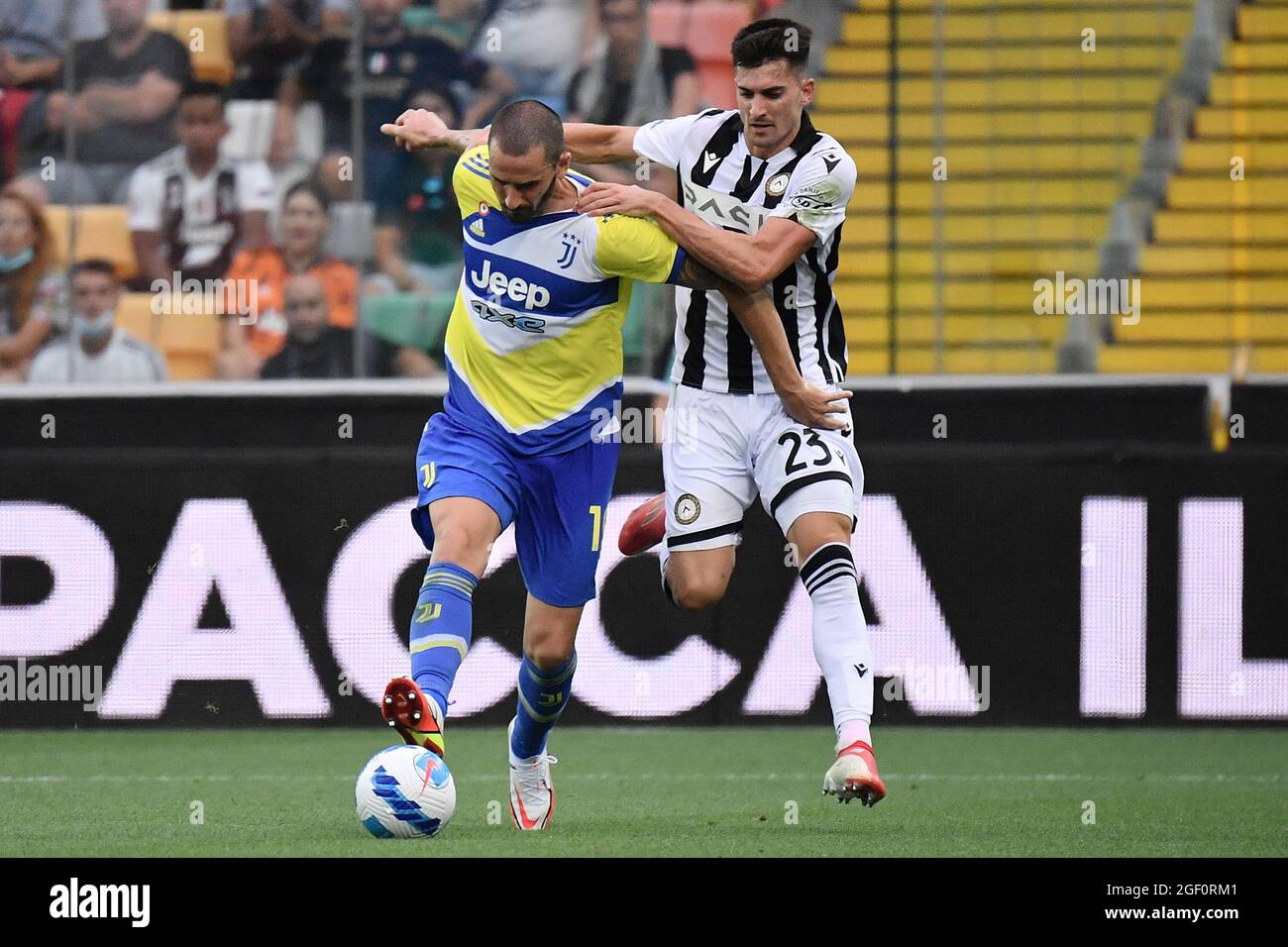 Udine, Italy. 22nd Aug, 2021. Leonardo Bonucci of Juventus FC and Ignacio  Pussetto of Udinese Calcio compete for the ball during the Serie A football  match between Udinese Calcio and Juventus FC