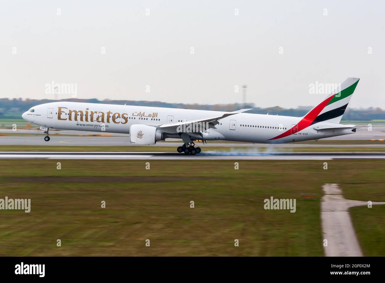 Vienna, Austria - November 30, 2011: Emirates Airlines passenger plane at airport. Schedule flight travel. Aviation and aircraft. Air transport. Globa Stock Photo