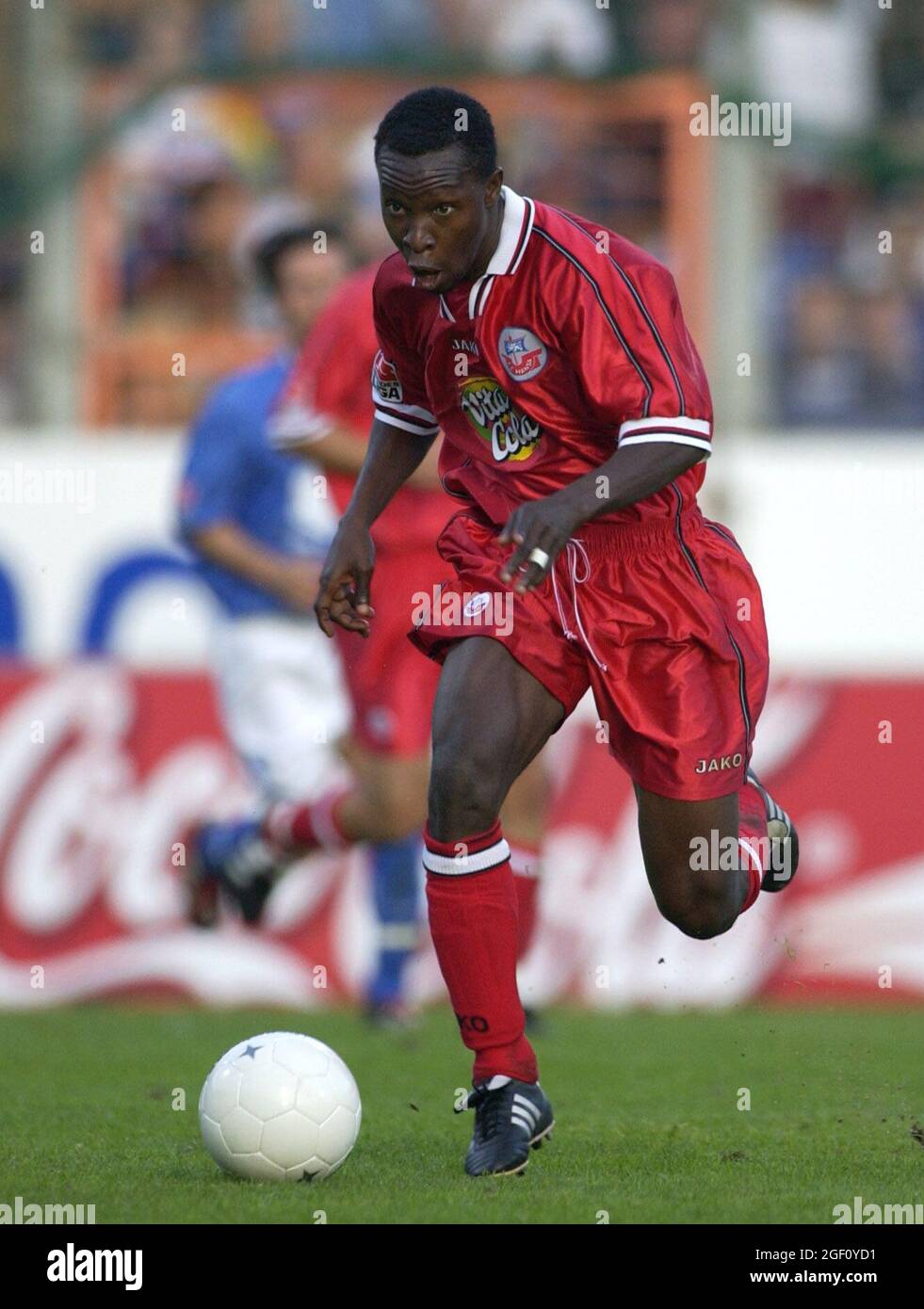 Bochum Germany 15.9.2002, Football: Bundesliga season 2002/03, VfL Bochum (VFL, blue) vs Hansa Rostock (HRO, red) 0:1 —  GODFRIED ADOUBE (HRO) Stock Photo