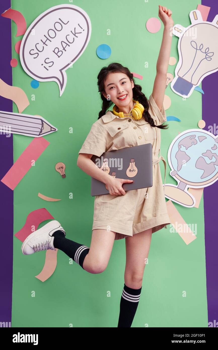 Young girl with a laptop Stock Photo - Alamy