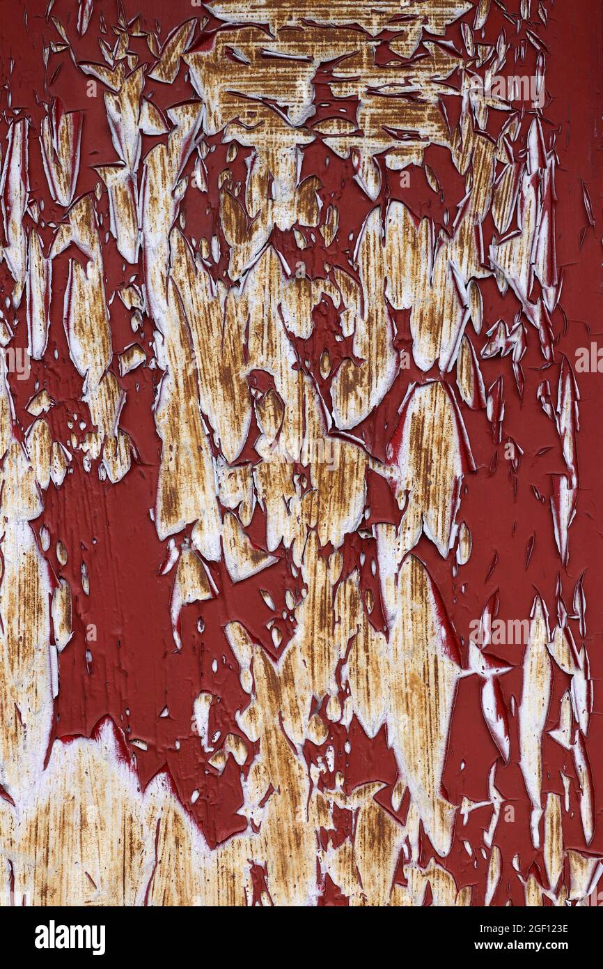 Detail of the cracked and peeled paint on the iron surface Stock Photo