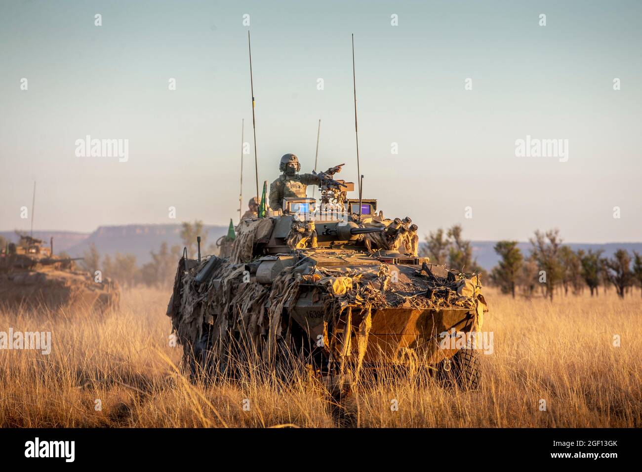 Bradshaw Station, Australia. 21st Aug, 2021. Australian Army soldiers with 1st Armored Regiment in Australian Service Light Armored Vehicle during a live-fire exercise at Bradshaw Field Training Area August 21, 2021 in Bradshaw Station, NT, Australia. Credit: Planetpix/Alamy Live News Stock Photo