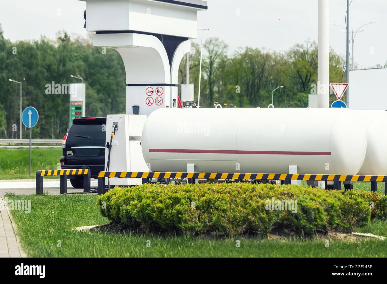 Liquid propane gas station. Black modern SUV car refueling tank with alternative power natural liquefied fuel Stock Photo