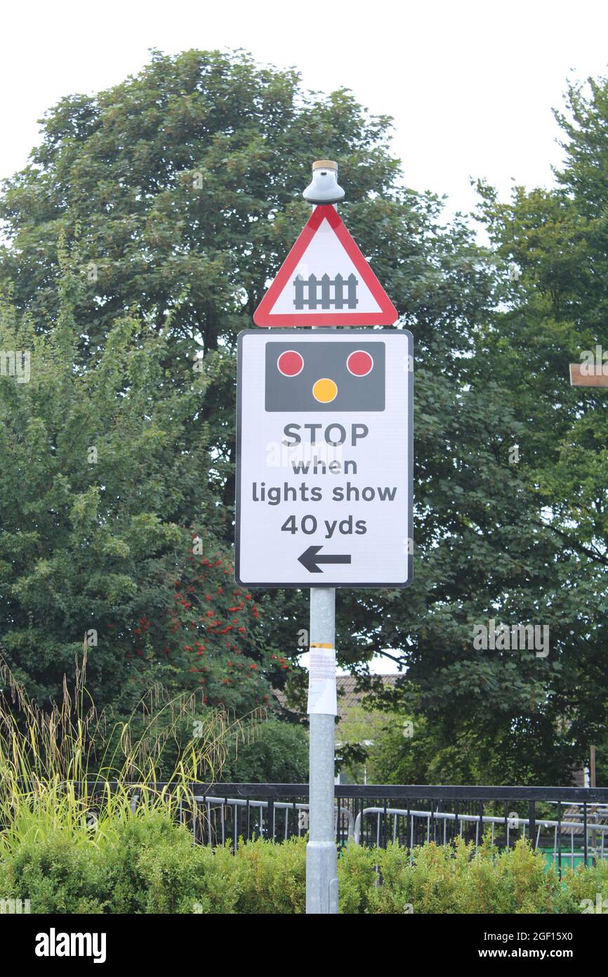 Railway crossing sign, Stop when lights show 40yds. Rail travel concept Stock Photo