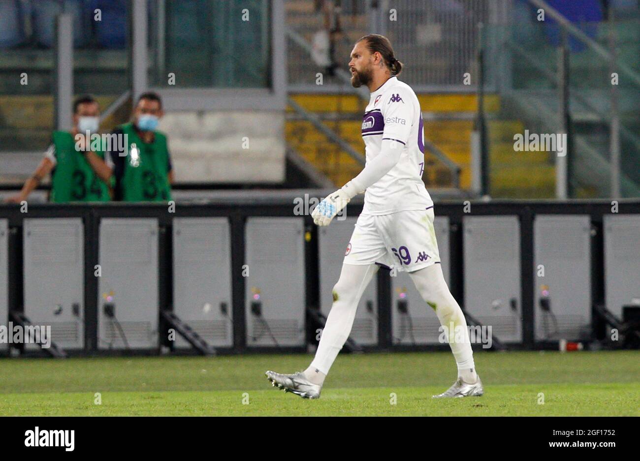Rome, Italy. 22nd Aug, 2021. Bartlomiej Dragowski, goalkeeper of Fiorentina, leaves the pitch after receiving a red card during the Serie A soccer match between Roma and Fiorentina at the Olympic Stadium. Credit: Stefano Massimo/Alamy Live News Stock Photo