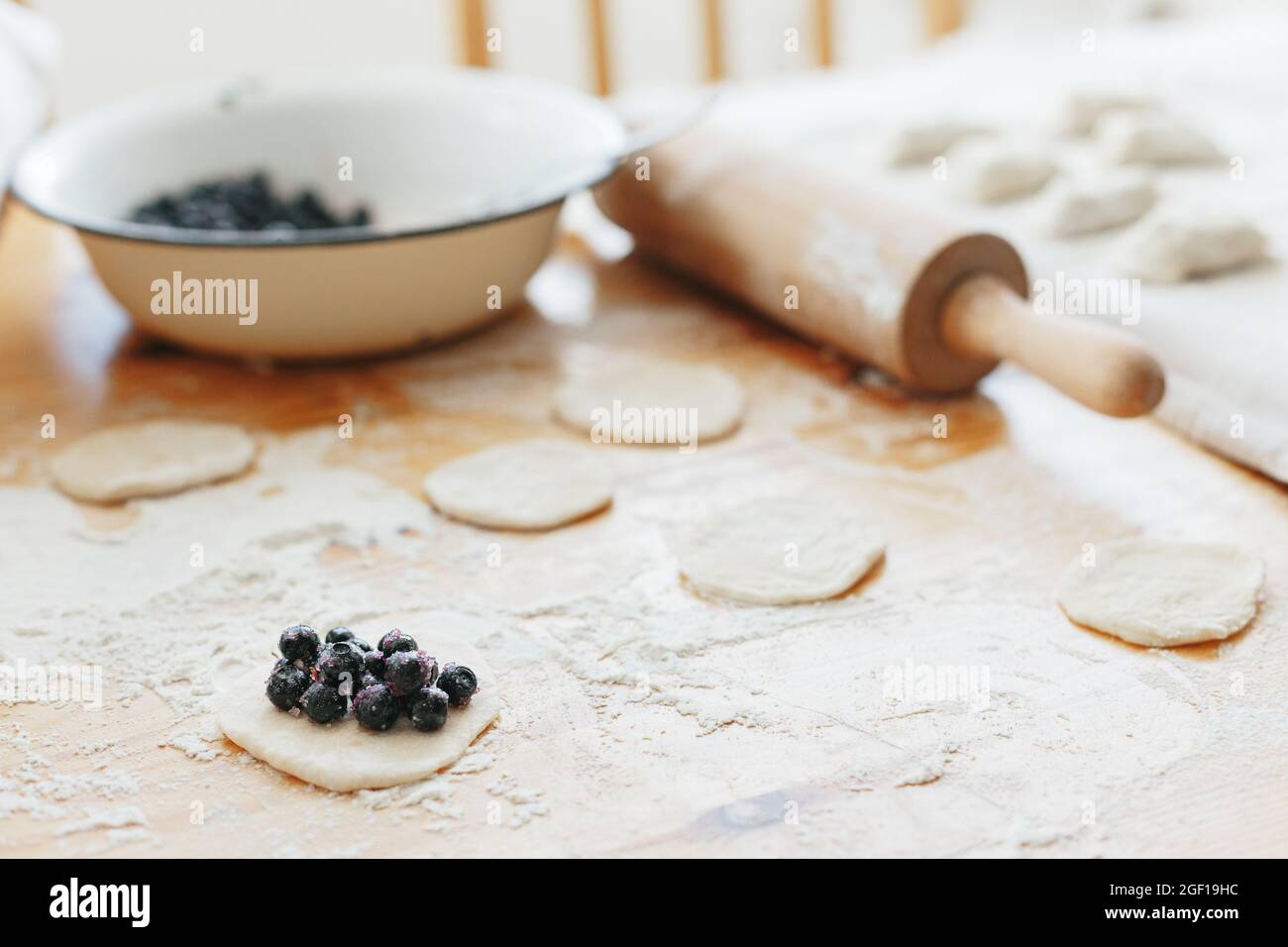 Process of making sweet vareniki with berries traditional ukrainian food Stock Photo