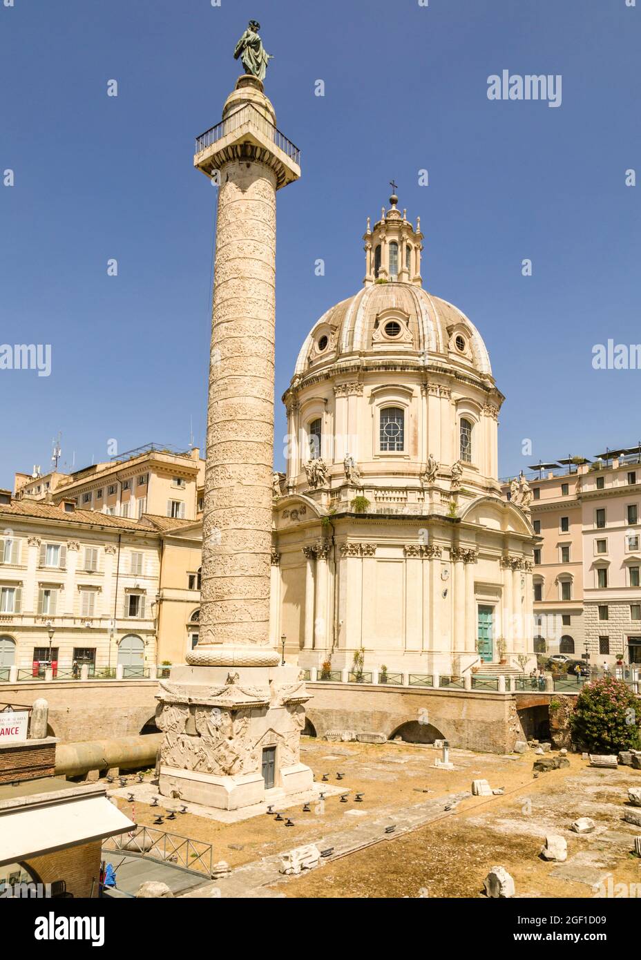 Trajan's Column, with The Church of the Most Holy Name of Mary in the background, Rome, Italy Stock Photo
