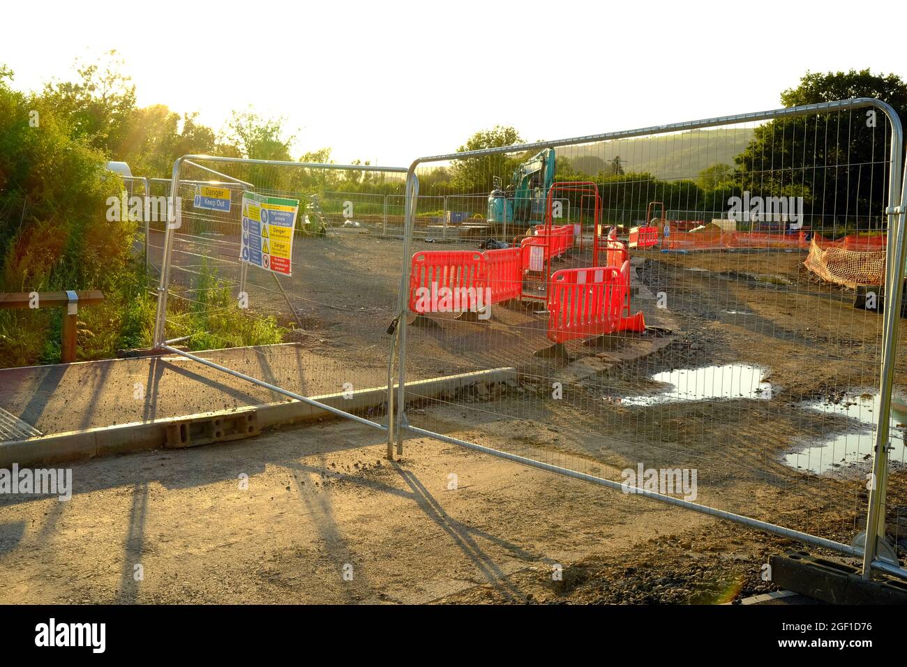 August 2021 - Heras fencing at the entrance to a new house building site in the rural village of Cheddar in Somerset, UK. Stock Photo