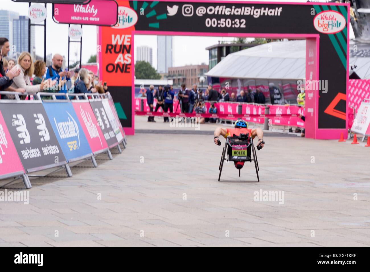 Sam Kolek elite wheelchair racer about to pass the finishing line at Cutty Sark in Big Half Marathon London UK 2021 Stock Photo