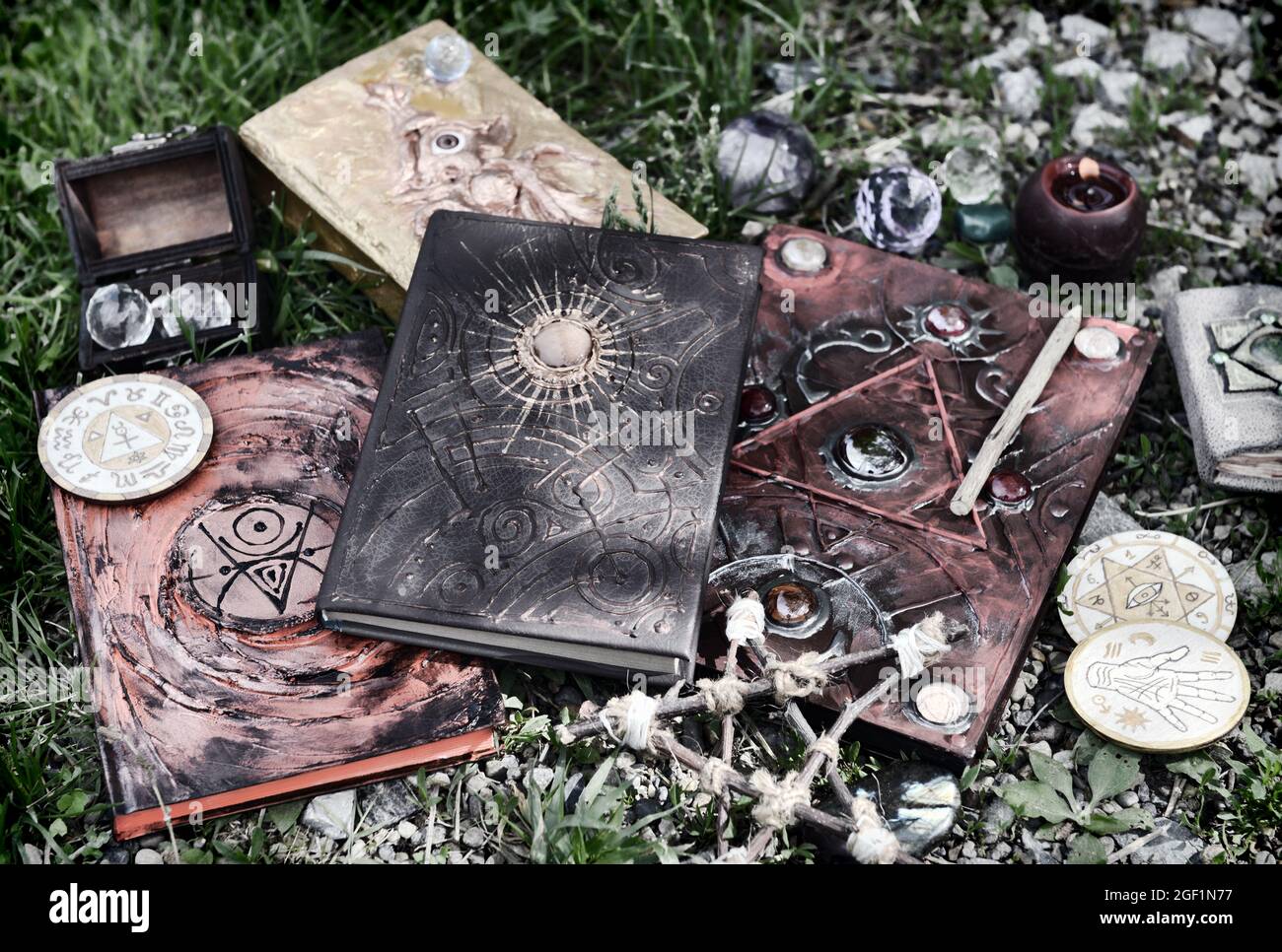 Grunge still life with magic books, witch objects, pentagram and candle.  Esoteric, gothic and occult background, Halloween mystic and wicca concept o Stock Photo