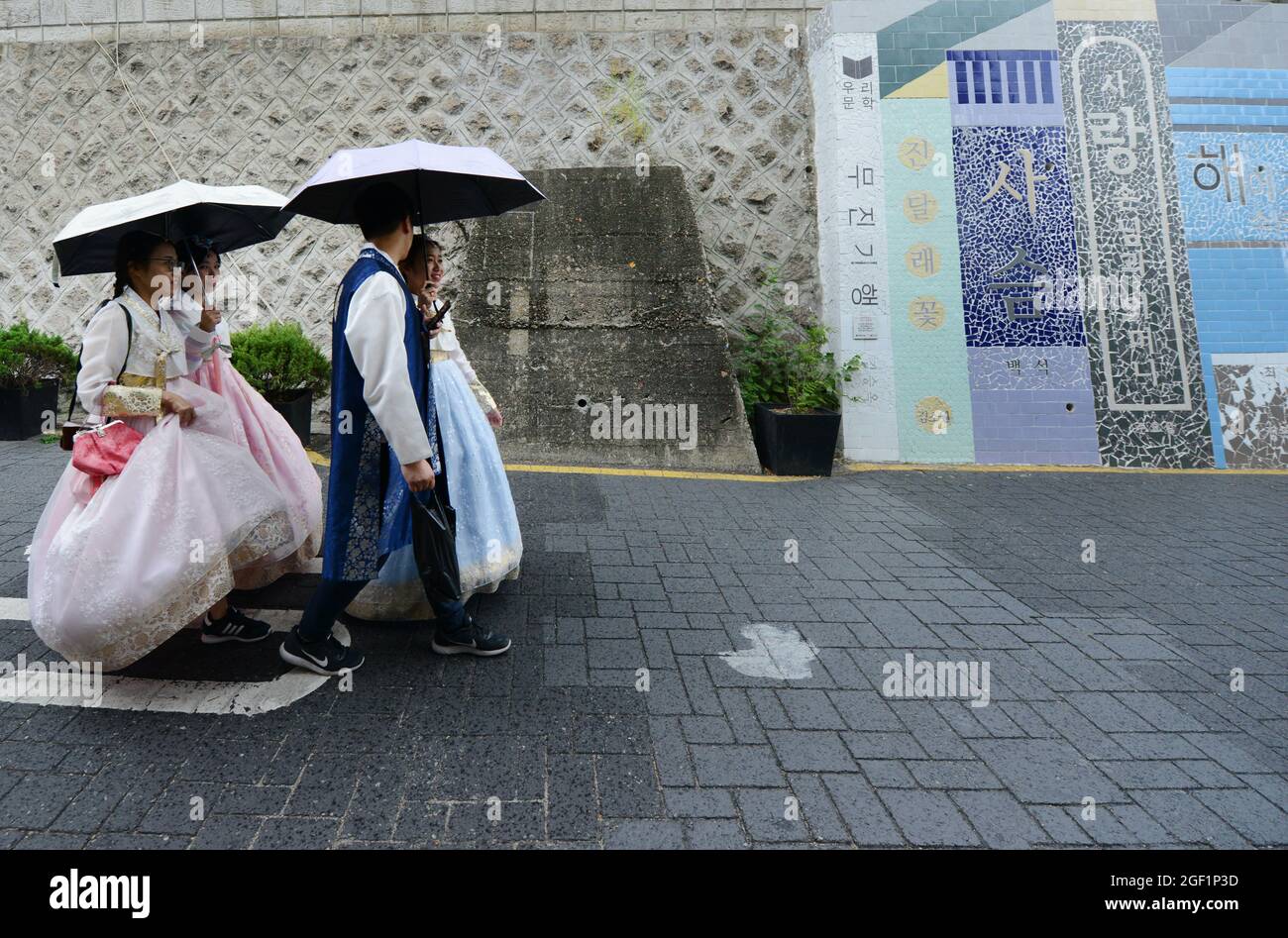 Tourist wearing traditional Korean dress at the Bukchon Hanok village in Seoul, Korea. Stock Photo
