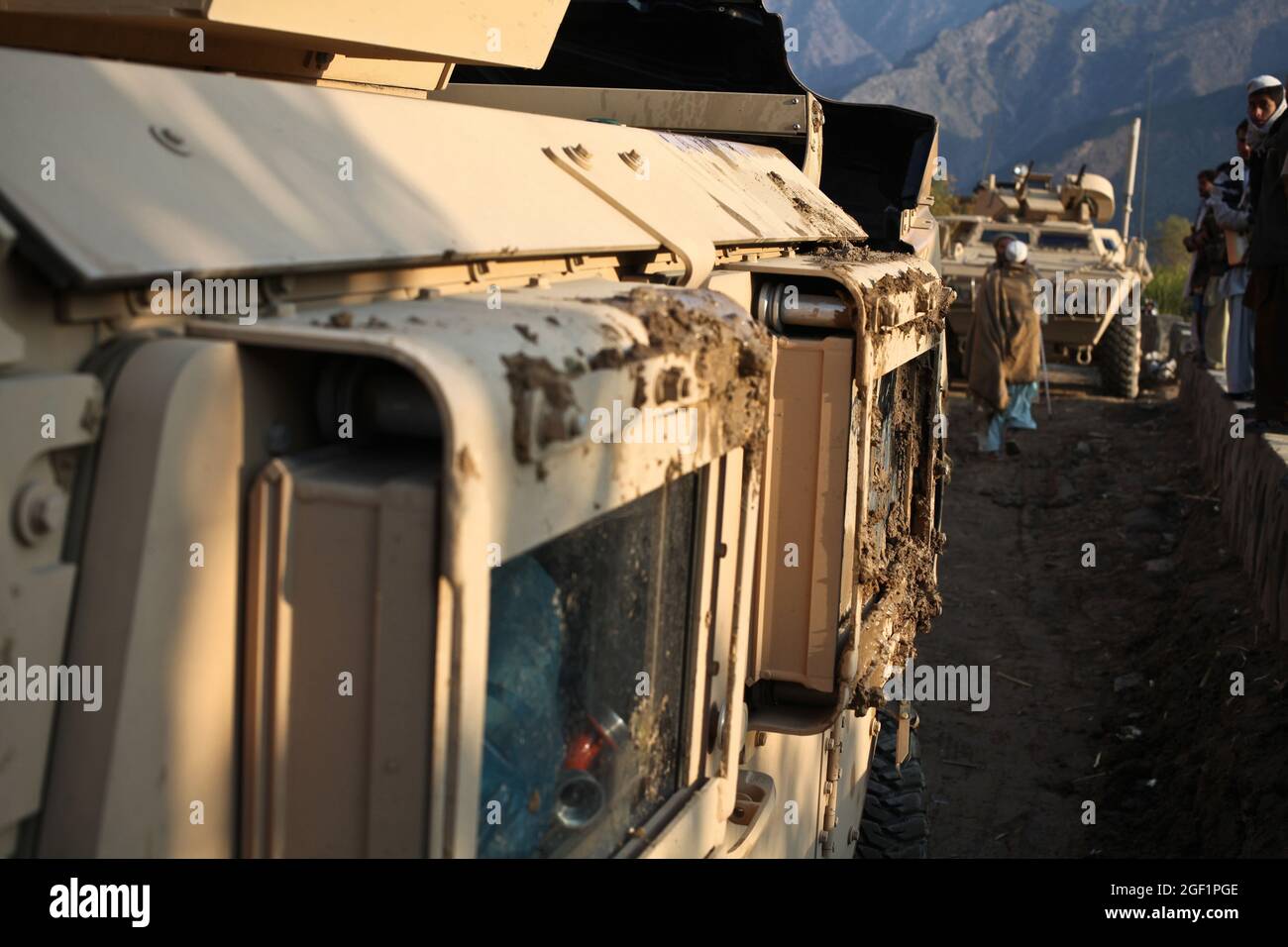 Mud remains over the windows of a humvee that rolled over during a patrol across the Munay Village in the Shigal district of Kunar province, Afghanistan on Dec. 7.The vehicle, which belongs to Combat Company, 1st Battalion, 32nd Infantry Regiment, rolled over due to the bad condition of the road. Stock Photo