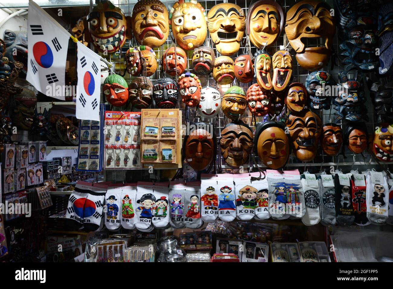 Korean masks, sox and other souvenirs displayed at a souvenir shop on Insadong-gil pedestrian street in Seoul, Korea. Stock Photo