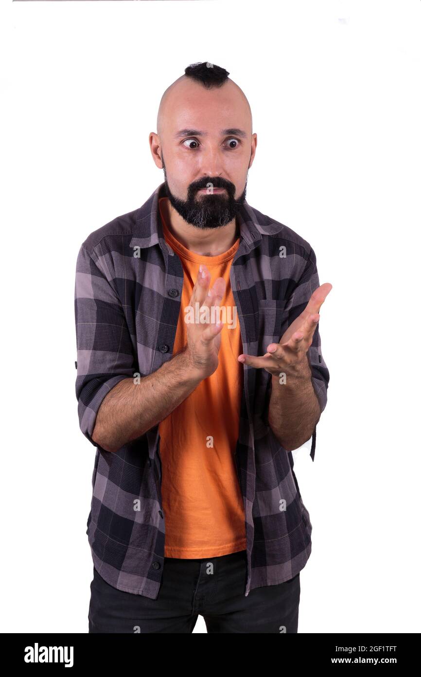 Overwhelmed young man gesturing in fustration and surprise Stock Photo