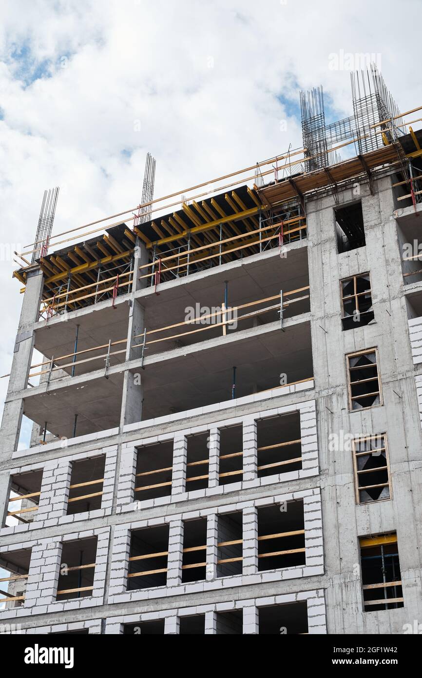 Vertical shot of residential building under construction with brick and