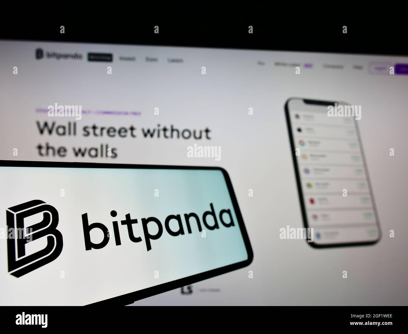 Mobile phone with logo of Austrian crypto exchange company Bitpanda GmbH on  screen in front of business website. Focus on left of phone display Stock  Photo - Alamy