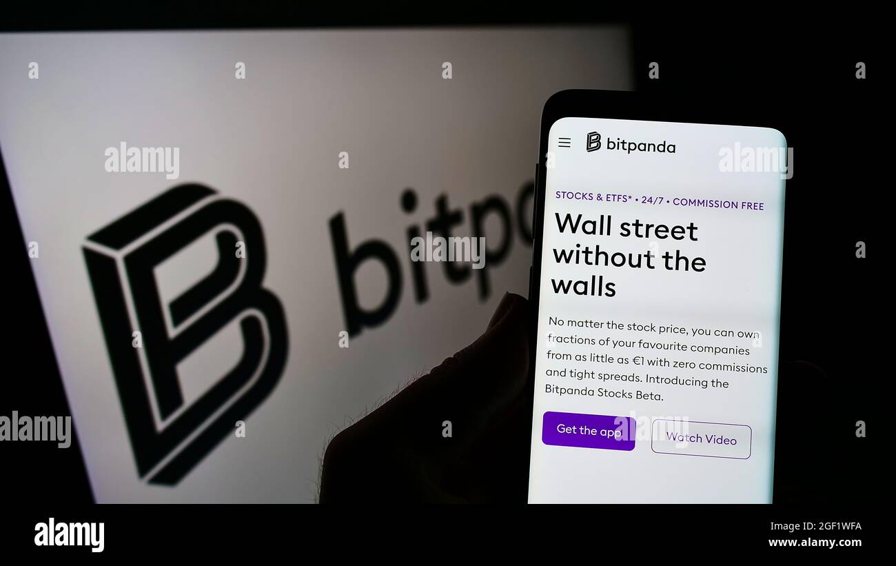 Smartphone with website of Austrian crypto exchange company Bitpanda GmbH  on screen in front of business logo. Focus on top-left of phone display  Stock Photo - Alamy
