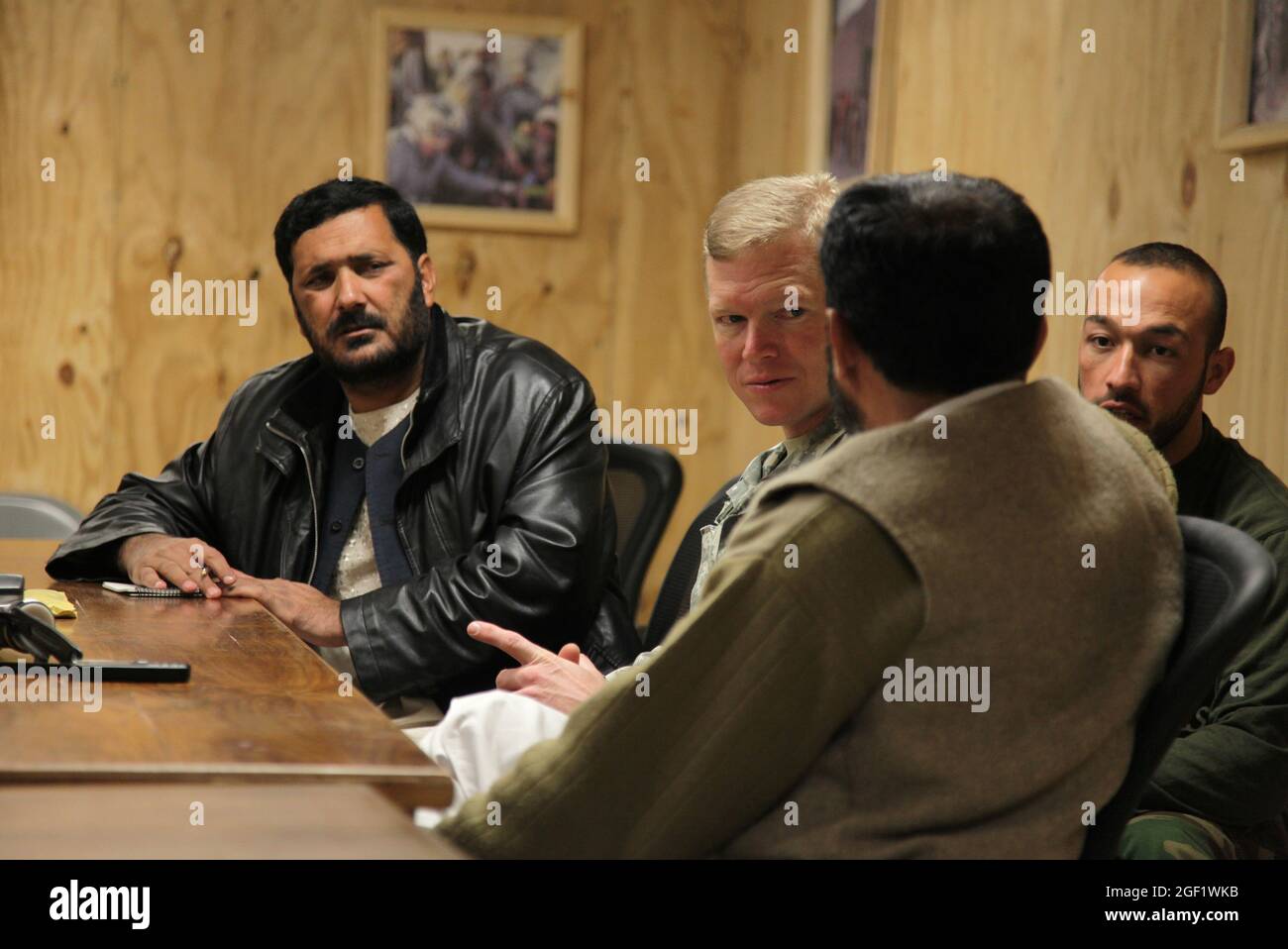 U.S. Army Lt. Col. Frederick O'Donnell is interviewed by Afghan local journalists inside the conference room at Forward Operation Base Joyce, Afghanistan, Dec. 12, 2009. O'Donnell is the commander of 1st Battalion, 32nd Infantry Regiment, 3rd Brigade Combat Team, 10th Mountain Division. Stock Photo