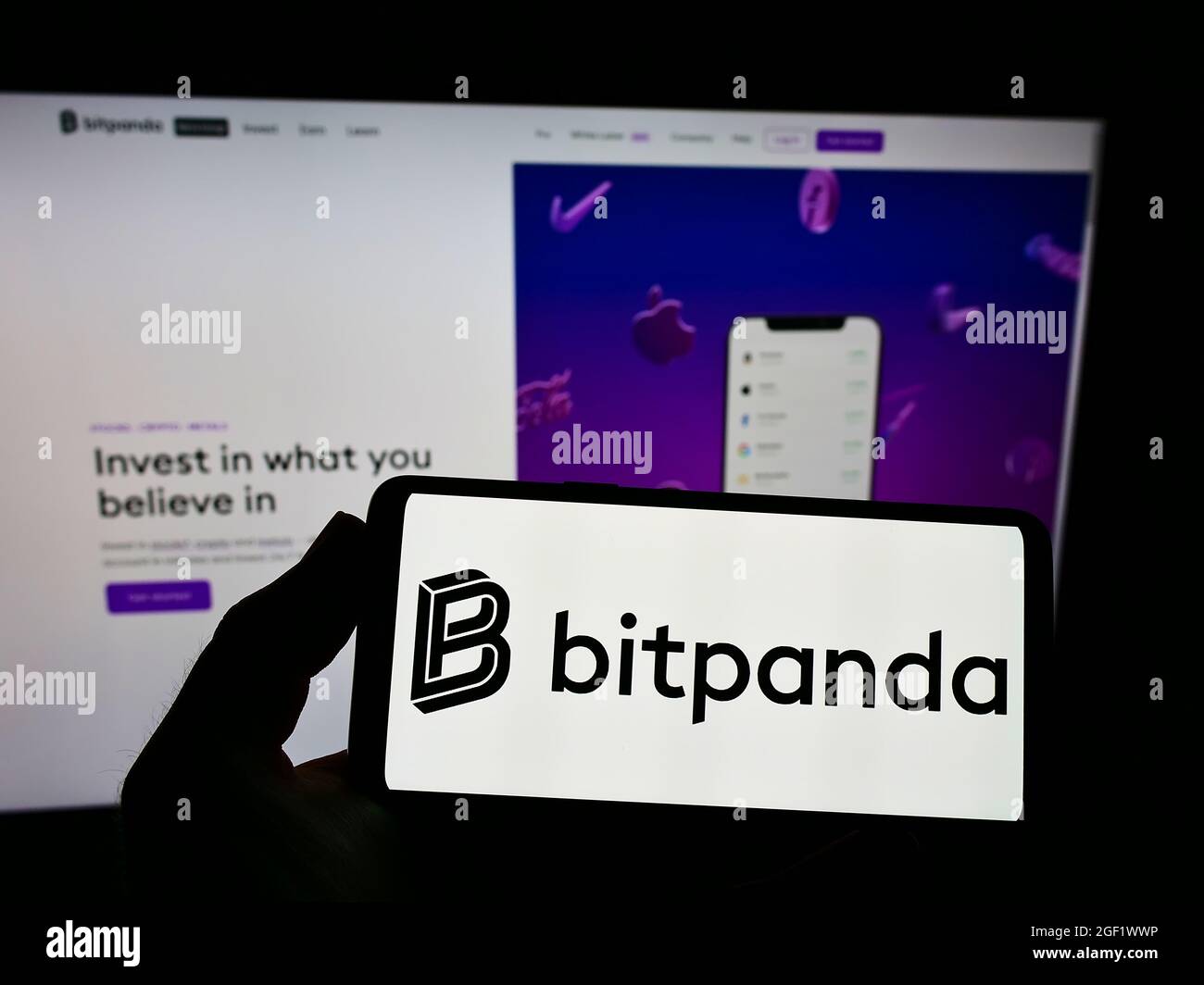 Person holding smartphone with logo of Austrian crypto exchange company  Bitpanda GmbH on screen in front of website. Focus on phone display Stock  Photo - Alamy