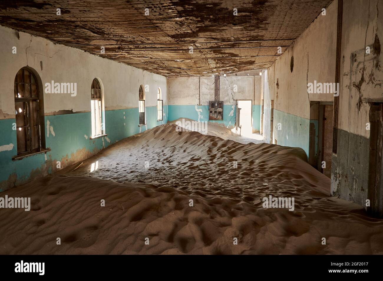 Interior of abandoned house filled with sand in ghost town of Kolmanskop, Namibia, Africa. Stock Photo