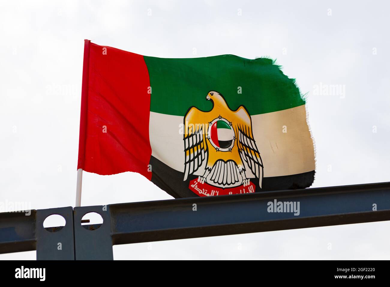 A United Arab Emirates flag flying in the wind Stock Photo