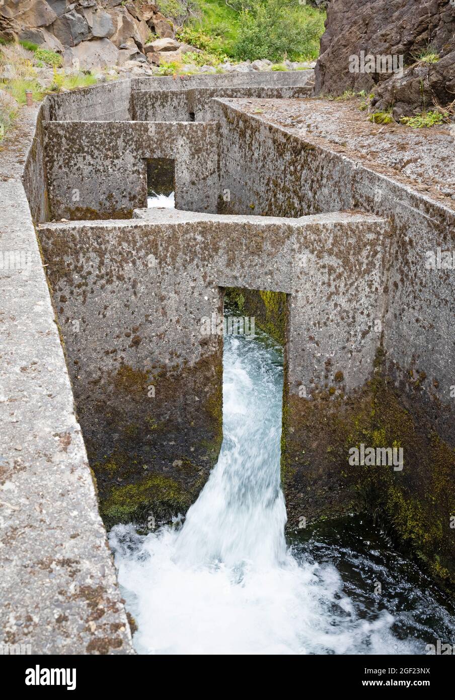View on a large concrete Salmon Ladder at an Icelandic waterfall ...