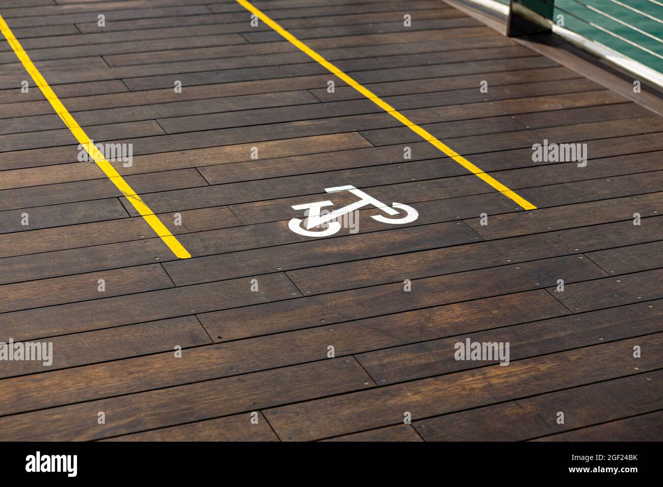 Bicycle sign on wooden bicycle lane in the city Stock Photo