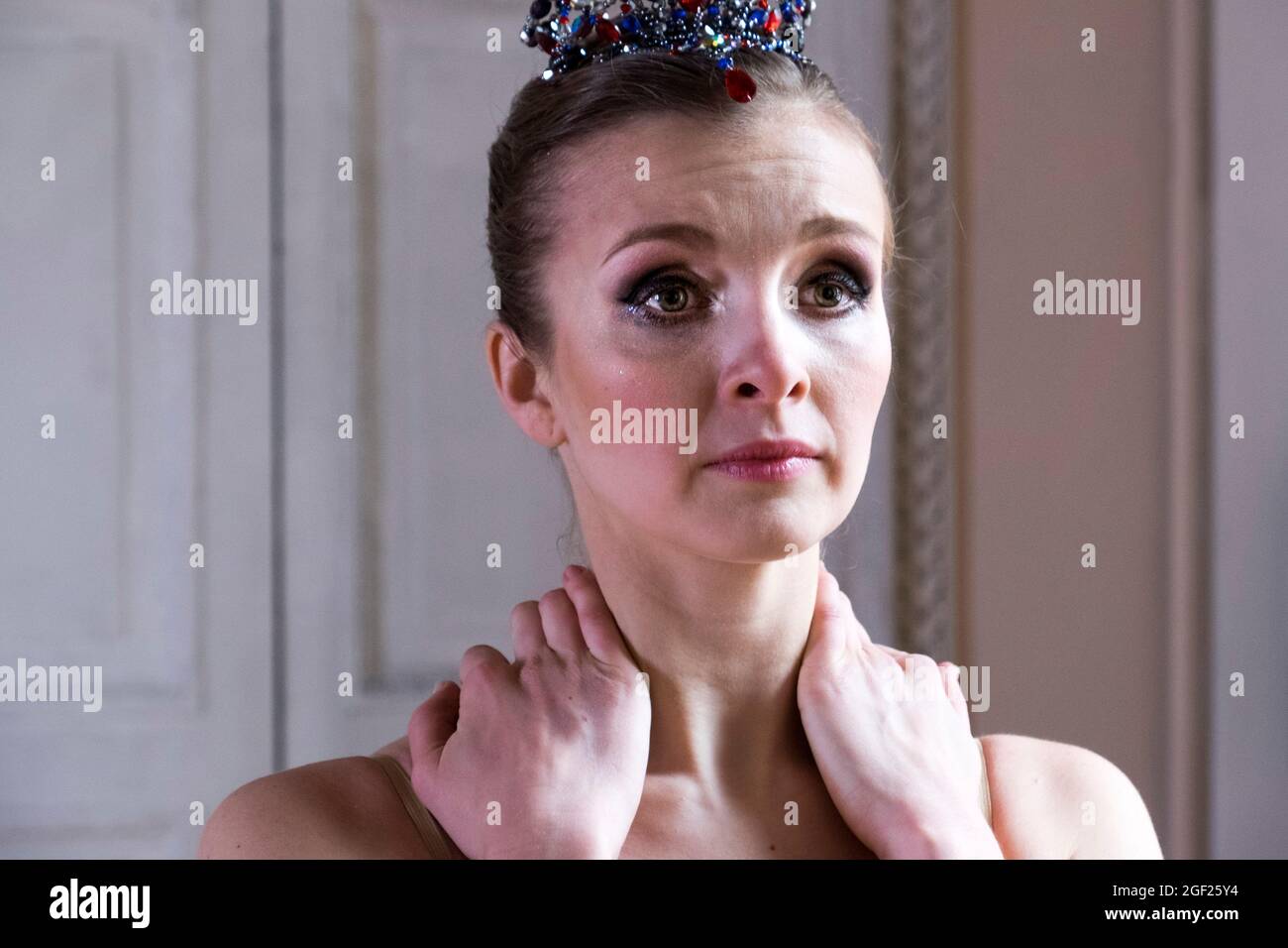 A young Russian ballerina ponders her next dance as she rehearses for a performance in Saint Petersburg, Russia Stock Photo