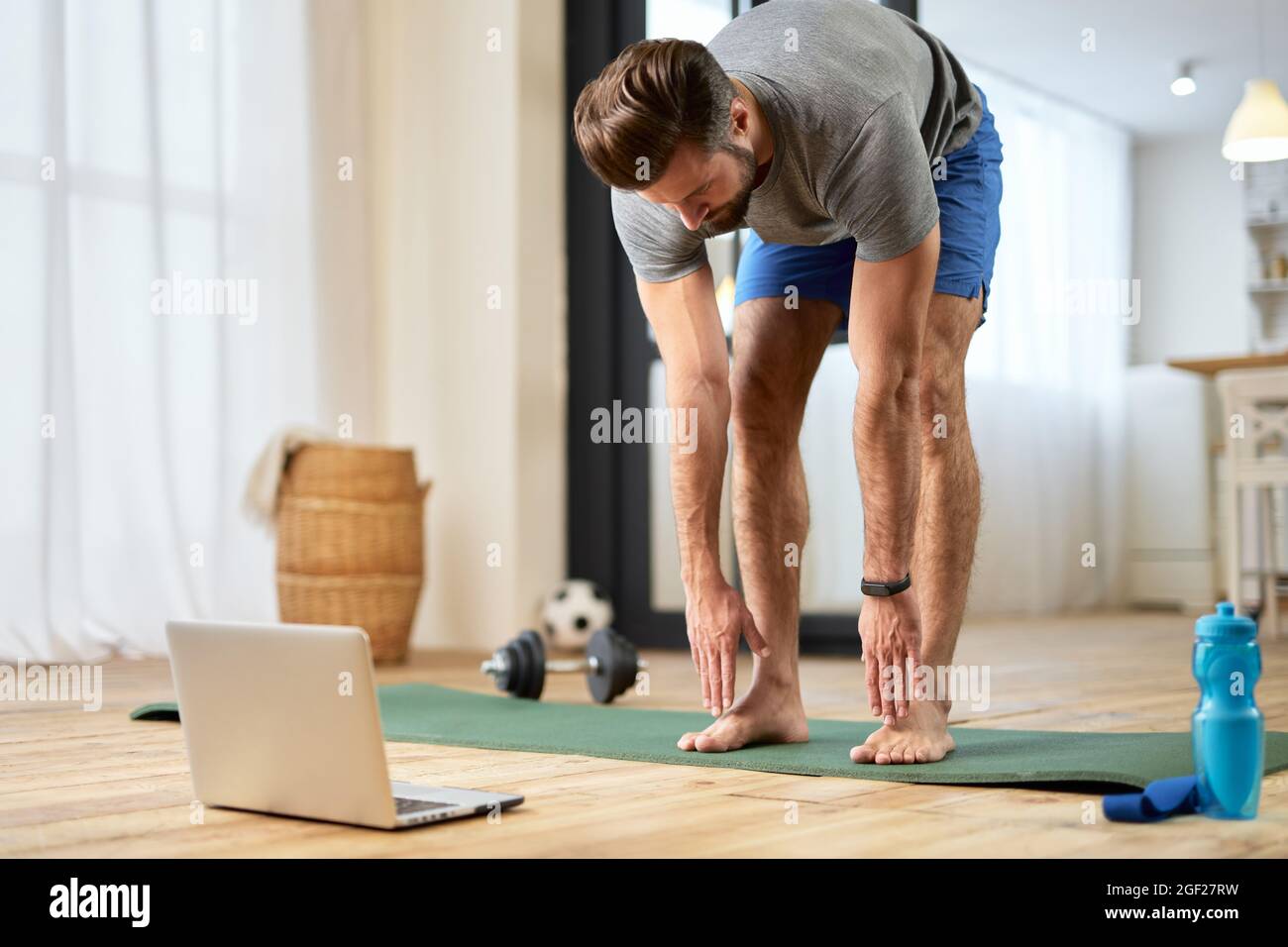 Person Working Out While Using Computer Man training laptop doing hi-res stock photography and images - Alamy