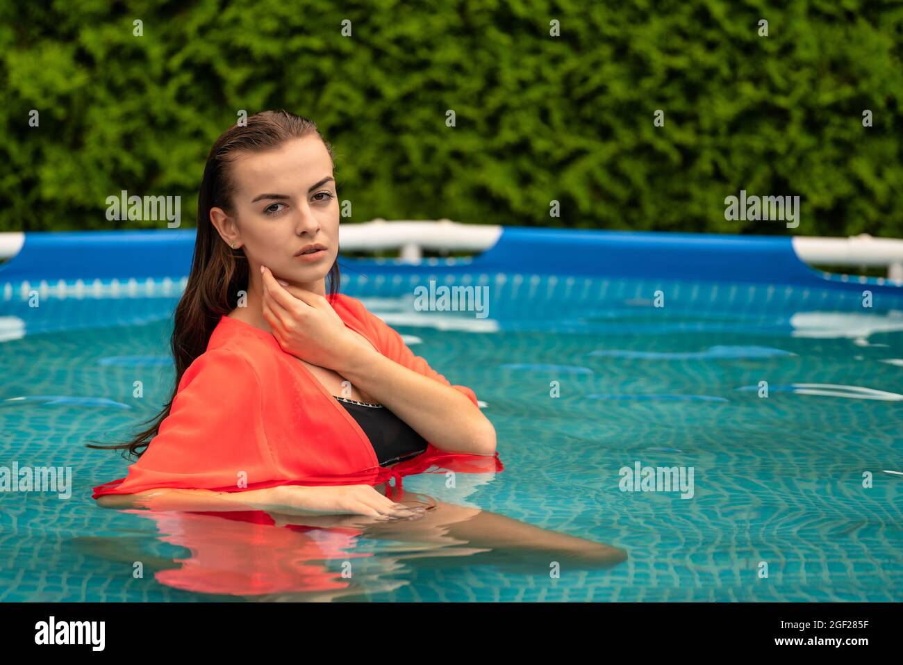 Portrait of a beautiful woman in the swimming pool Stock Photo - Alamy