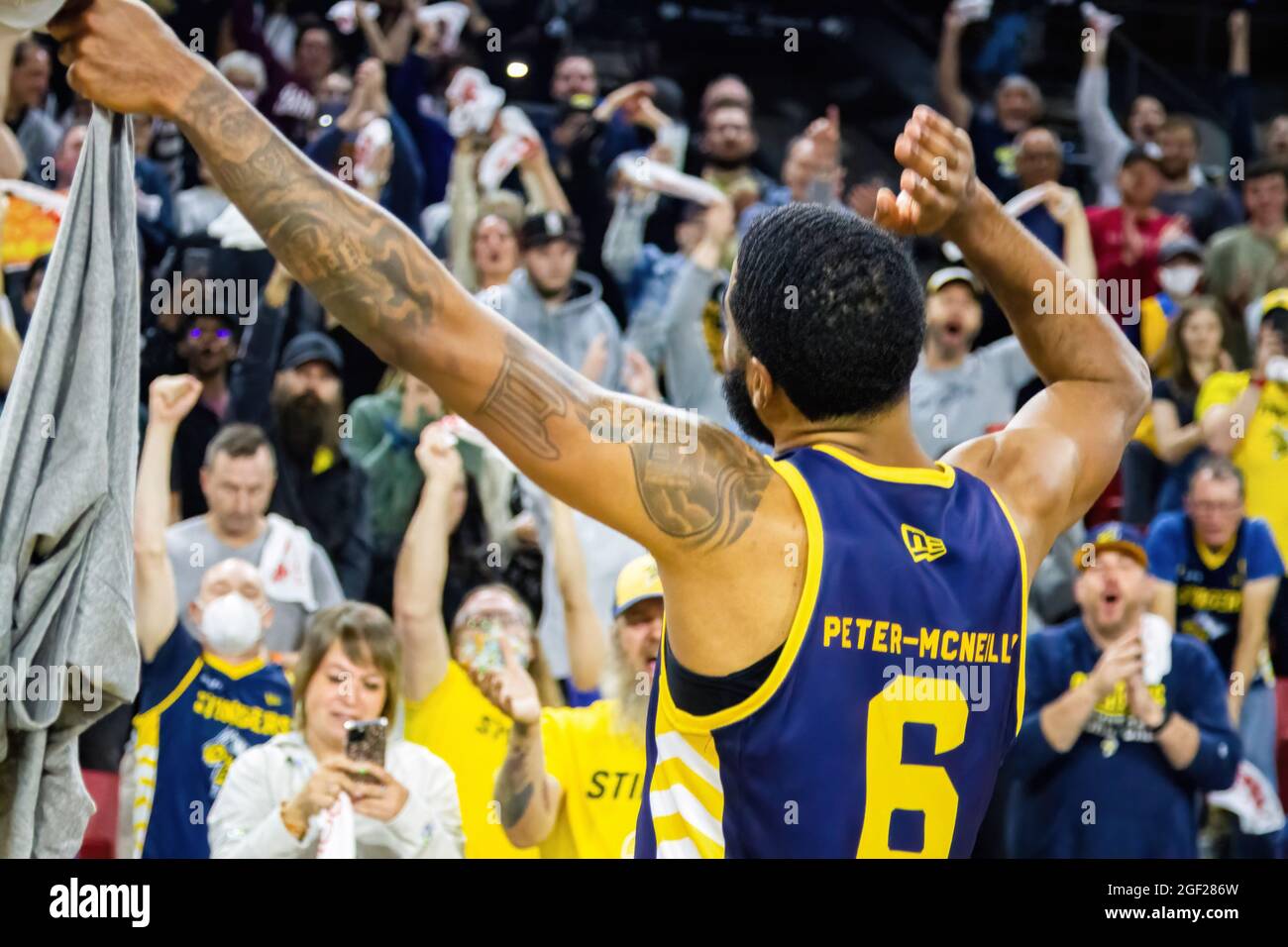 Adike Peter-McNeilly celebrates the Championship Win with their fans after the Canadian Elite Basketball Season Final between the Edmonton Stingers and the Niagara River Lions at the Edmonton Expo Center. The Edmonton Stingers claim their second straight CEBL Championship. (Photo by Ron Palmer / SOPA Images/Sipa USA) Stock Photo