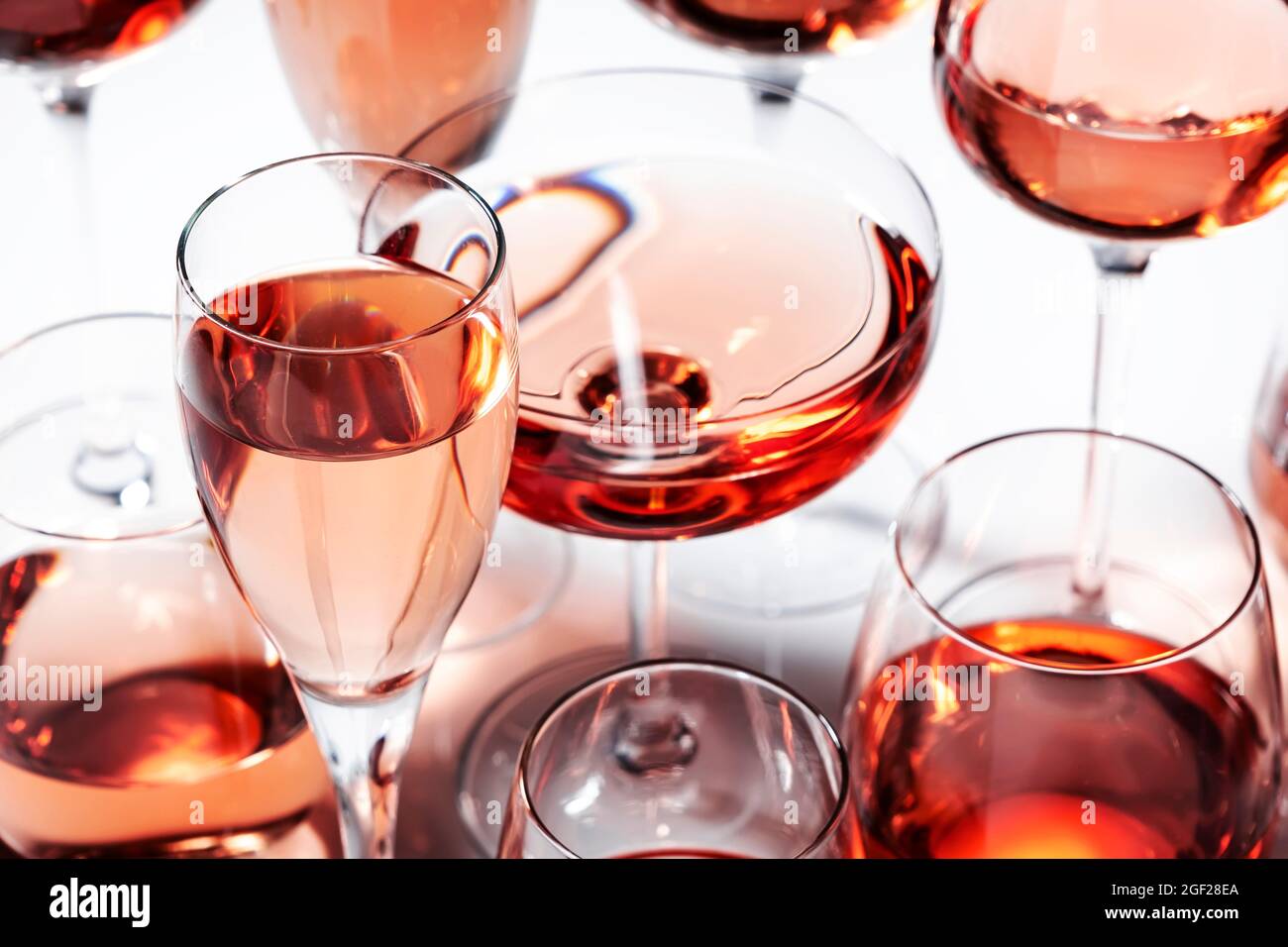 Rose wine of different shades in glasses on white background. Rosado, rosato  or blush wines tasting Stock Photo - Alamy