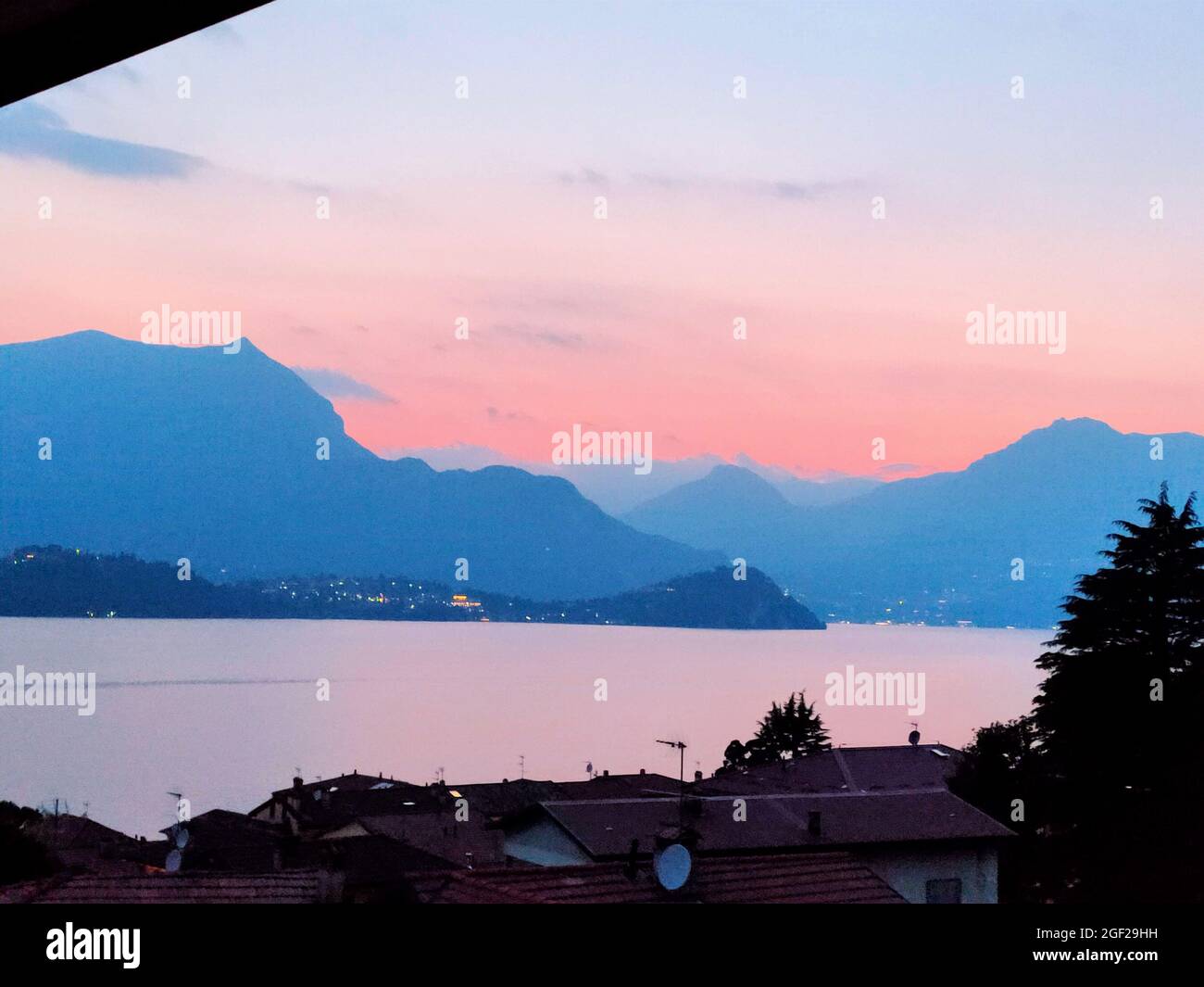 Sunset view from Lierna across Lake Como to the Bellagio headland, Lombardy, Italy Stock Photo