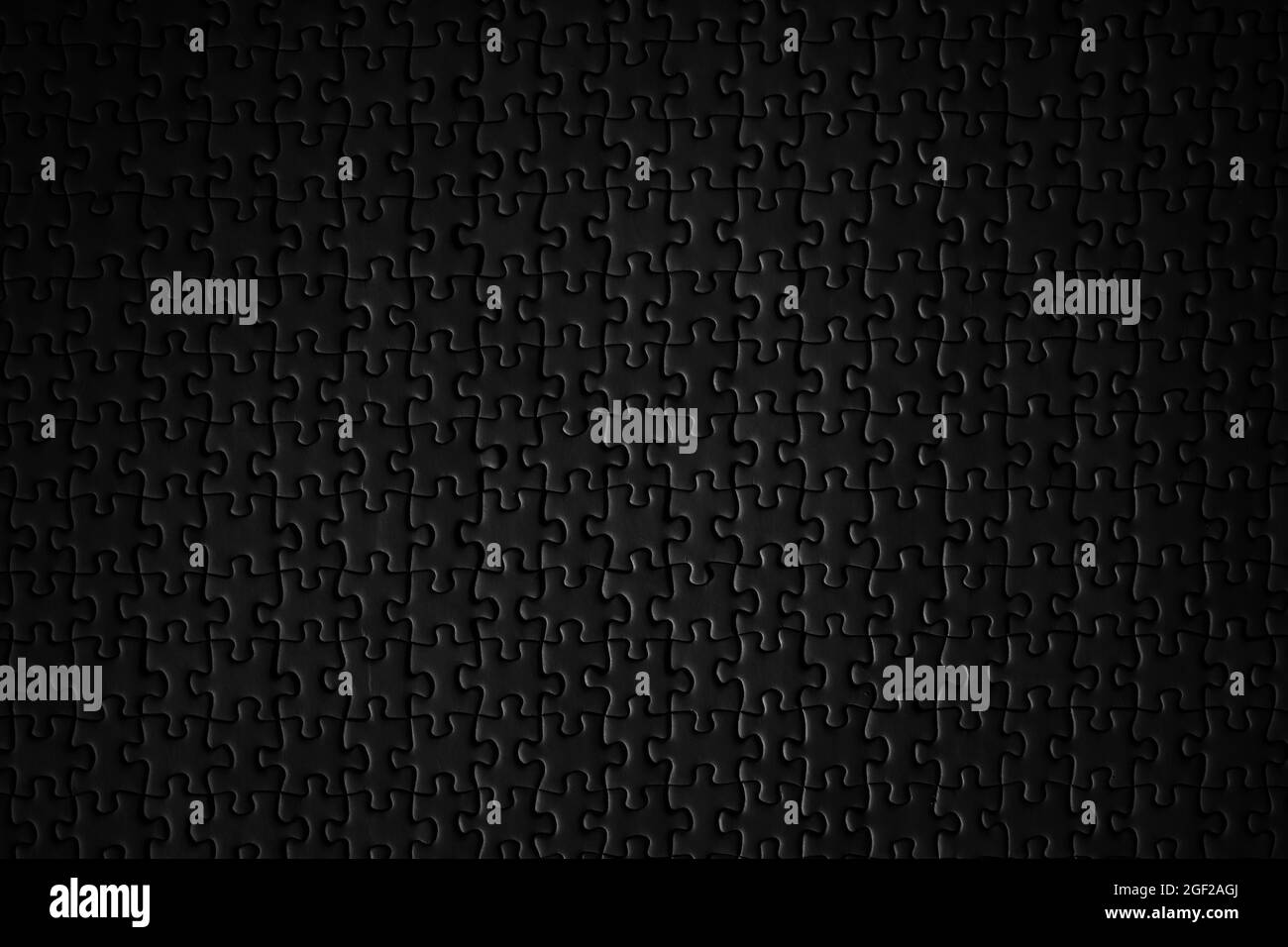 black jigsaw puzzle texture background Stock Photo
