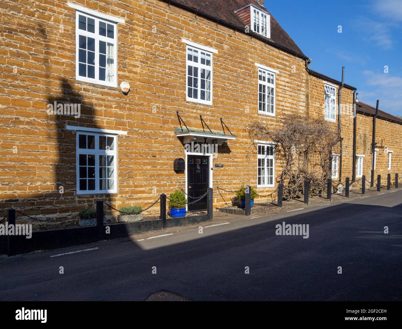 Street view in Spring in the pretty village of Dallington, Northampton, UK Stock Photo