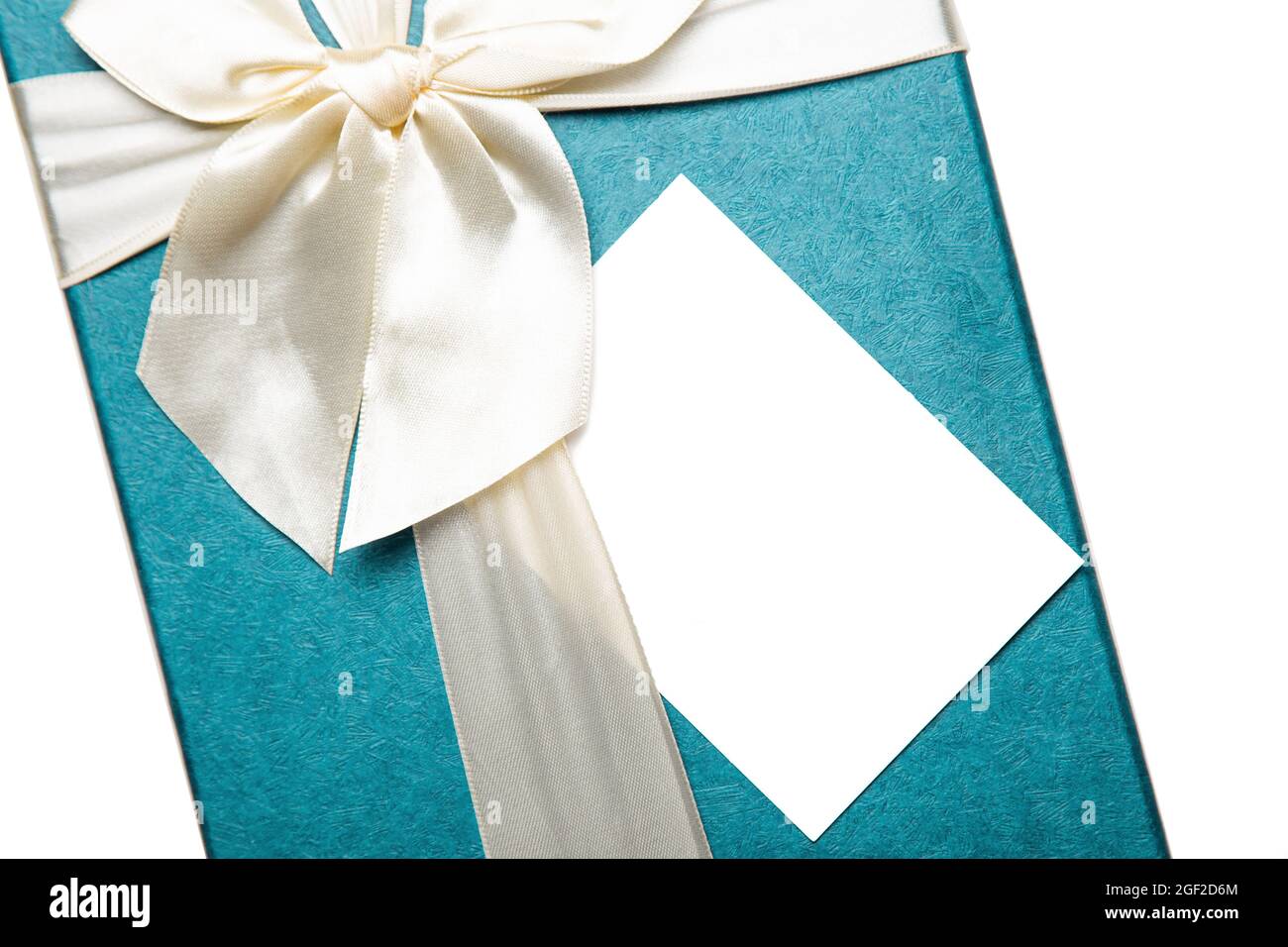 Gift box with empty white blank gift tag mock up. Christmas, birthday or wedding gift. Isolated background Stock Photo