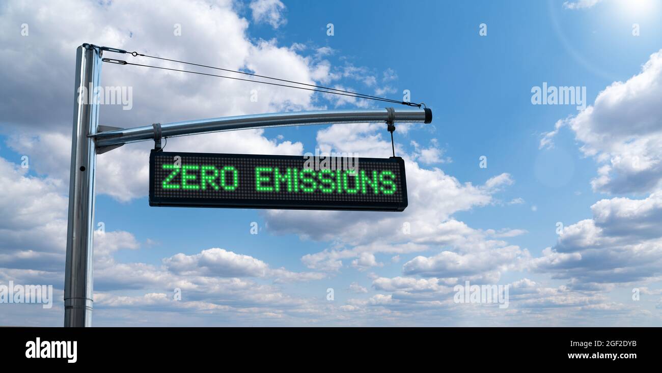 Road information board with text ZERO EMISSIONS on a background of blue sky. Clean mobility concept Stock Photo