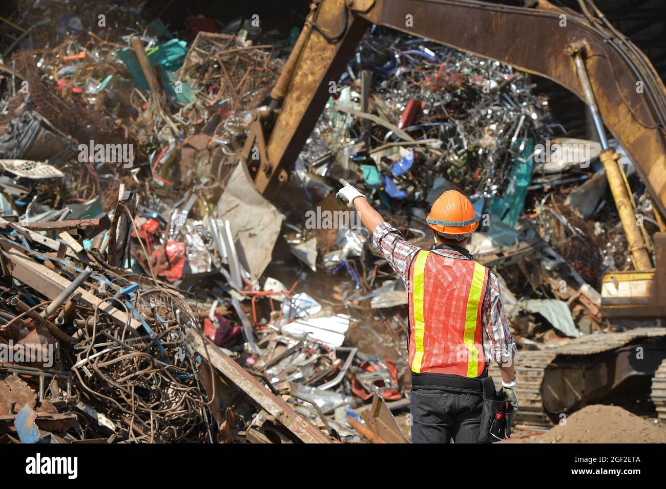 Hardsuits Biohazard Portrait workers wearing biohazard suits and hardhats working at waste ...