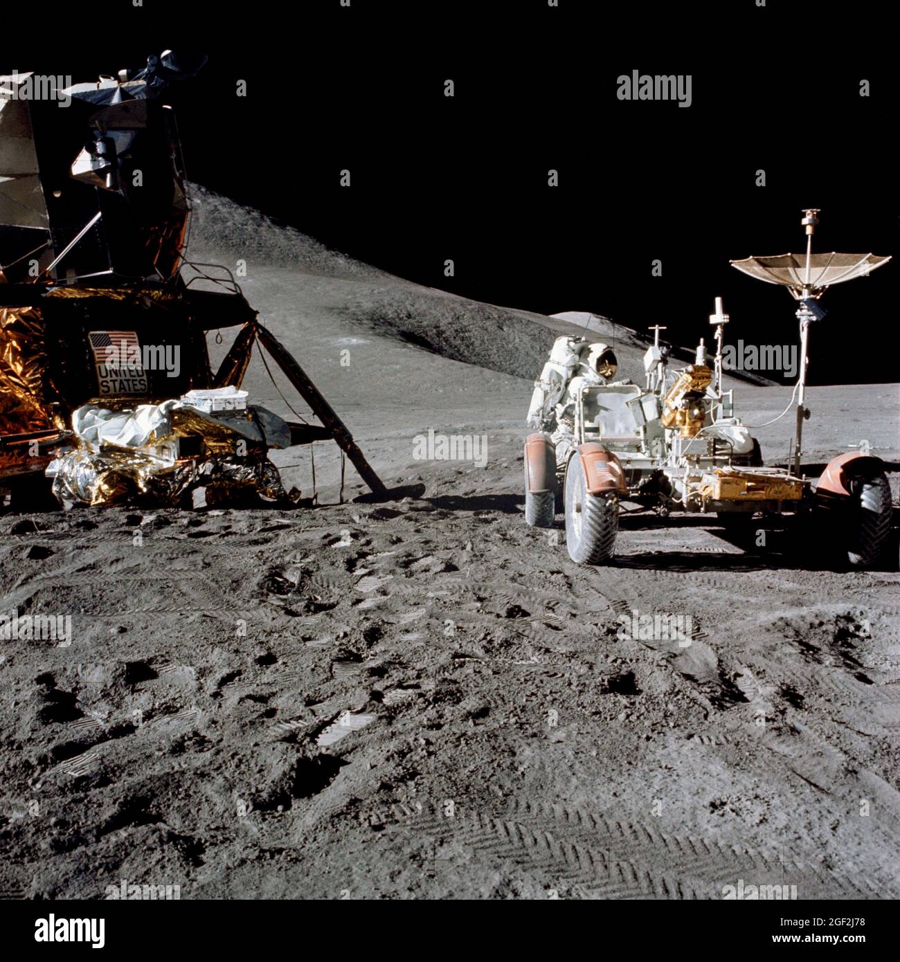 (31 July 1971) --- Astronaut James B. Irwin, lunar module pilot, works at the Lunar Roving Vehicle (LRV) during the first Apollo 15 lunar surface extravehicular activity (EVA) at the Hadley-Apennine landing site. A portion of the Lunar Module (LM) 'Falcon' is on the left. The undeployed Laser Ranging Retro Reflector (LR-3) lies atop the LM's modular equipment stowage assembly (MESA) Stock Photo