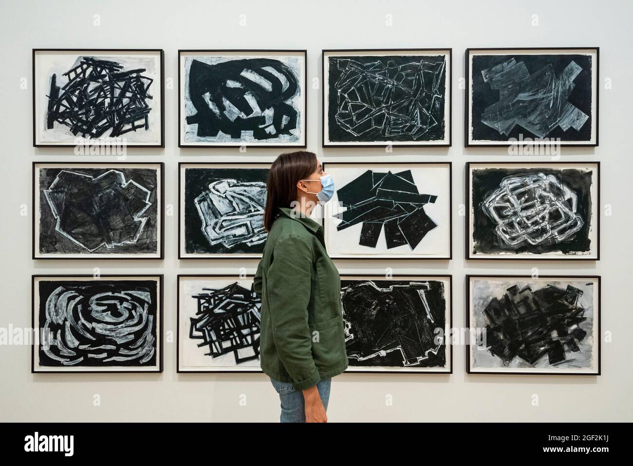 London, UK.  23 August 2021. A staff member views untitled monochromatic works at the preview of ARTIST ROOMS: Phyllida Barlow, a new exhibition of work by British artist Phyllida Barlow which includes several large-scale installations and a selection of drawings across her sixty-year career.   Credit: Stephen Chung / Alamy Live News Stock Photo