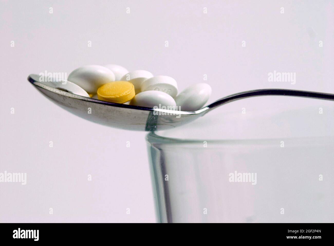 pills on a spoon Stock Photo