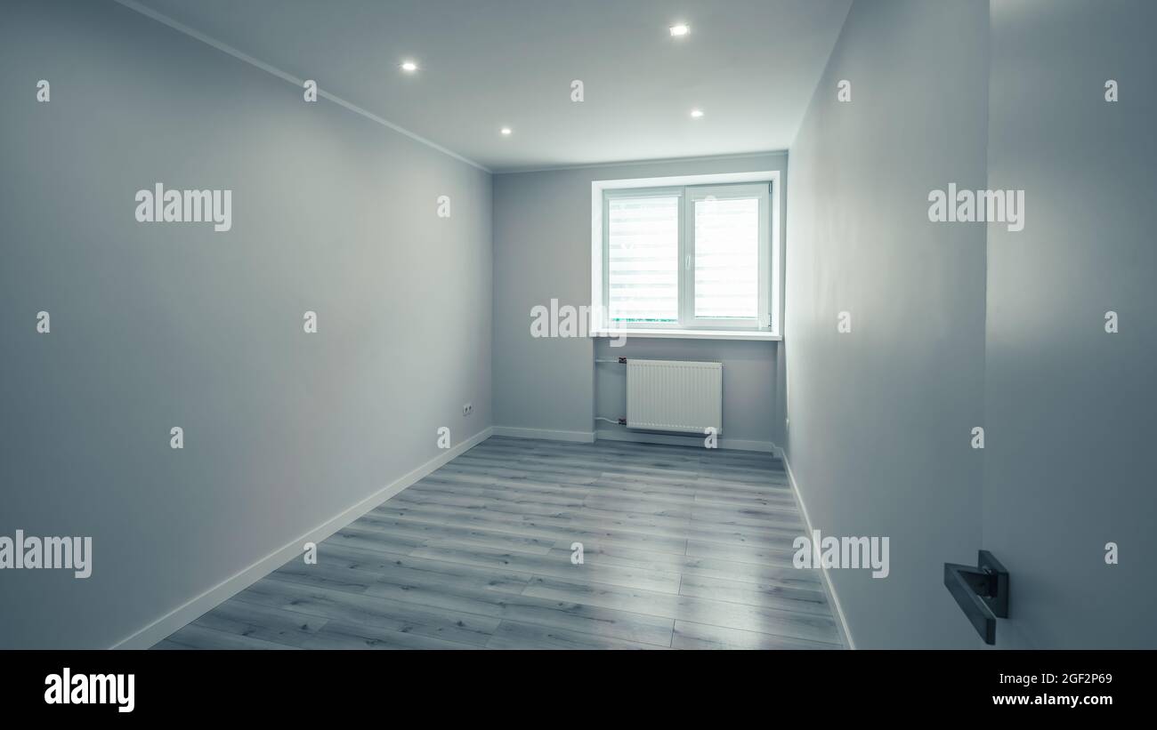 Modern interior of empty room. Apartment after renovation. White walls