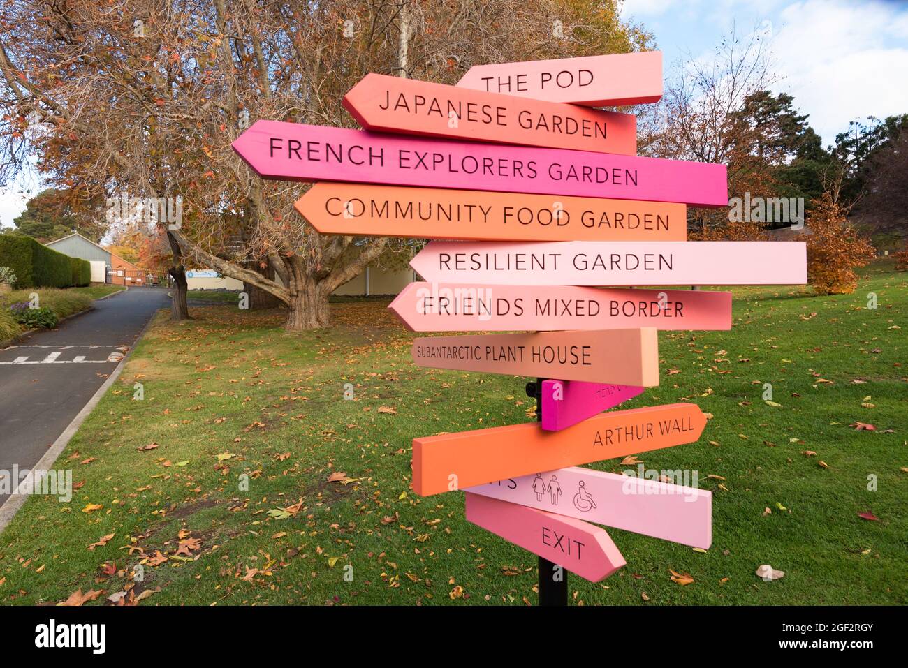 A multicoloured and multi-signed sign post in the Royal Tasmanian Botanical Gardens in the Queens Domain in Hobart, Tasmania, Australia Stock Photo