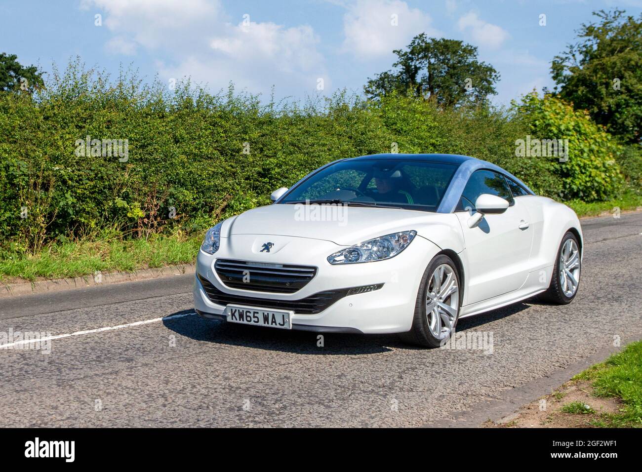 2016 white Peugeot RCZ GT HDI GT 1997cc diesel en-route to Capesthorne Hall classic July car show, Cheshire, UK Stock Photo