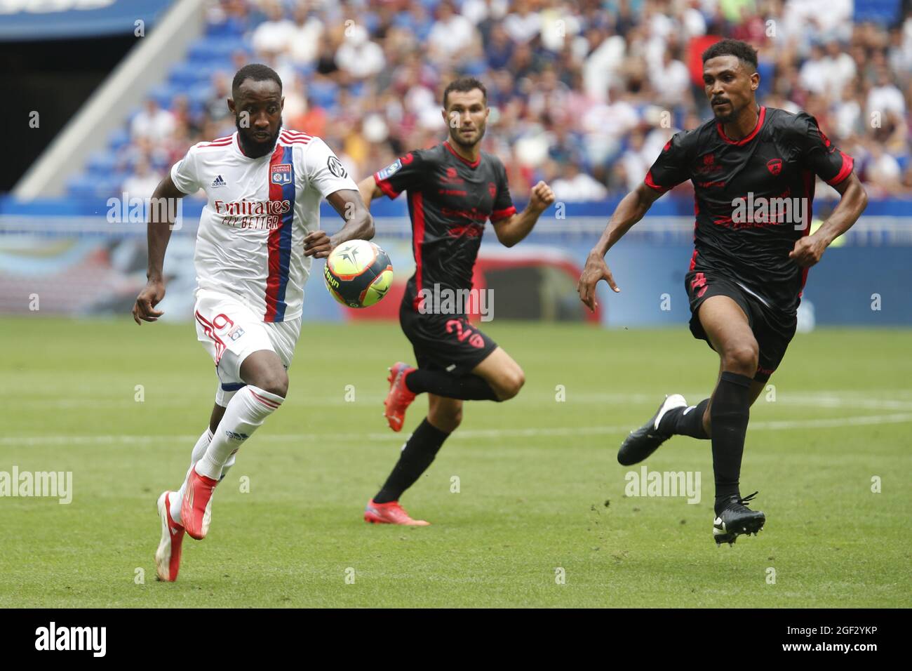 Moussa DEMBELE of Lyon and Cedric HOUNTONDJI of Clermont during the French championship Ligue 1 football match between Olympique Lyonnais and Clermont Foot 63 on August 22, 2021 at Groupama stadium in Decines-Charpieu near Lyon, France - Photo Romain Biard / Isports / DPPI Stock Photo