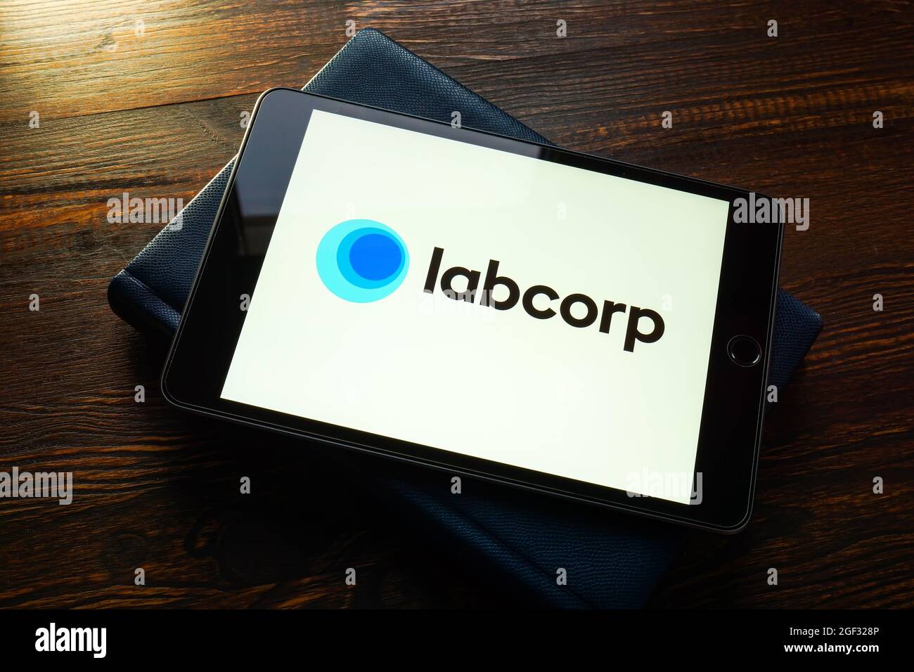 KYIV, UKRAINE - August 21, 2021. Labcorp Laboratory Corporation of America logo on the tablet. Stock Photo