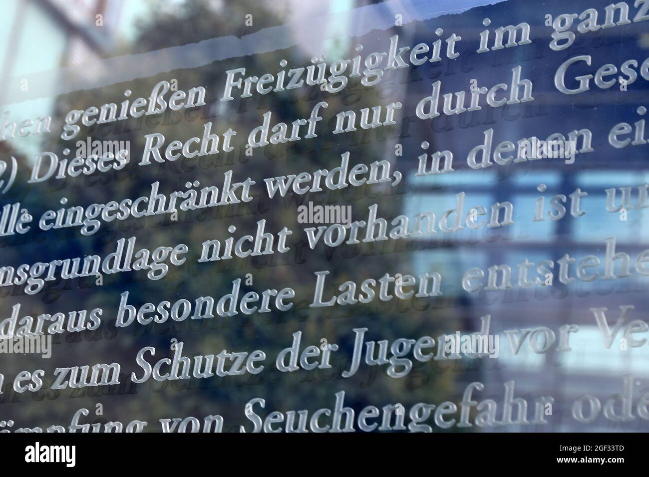 German Basic Law Article 11, Freedom of Movement (Freizügigkeit), photographed on the glass panes at Jakob-Kaiser-Haus in Berlin Stock Photo